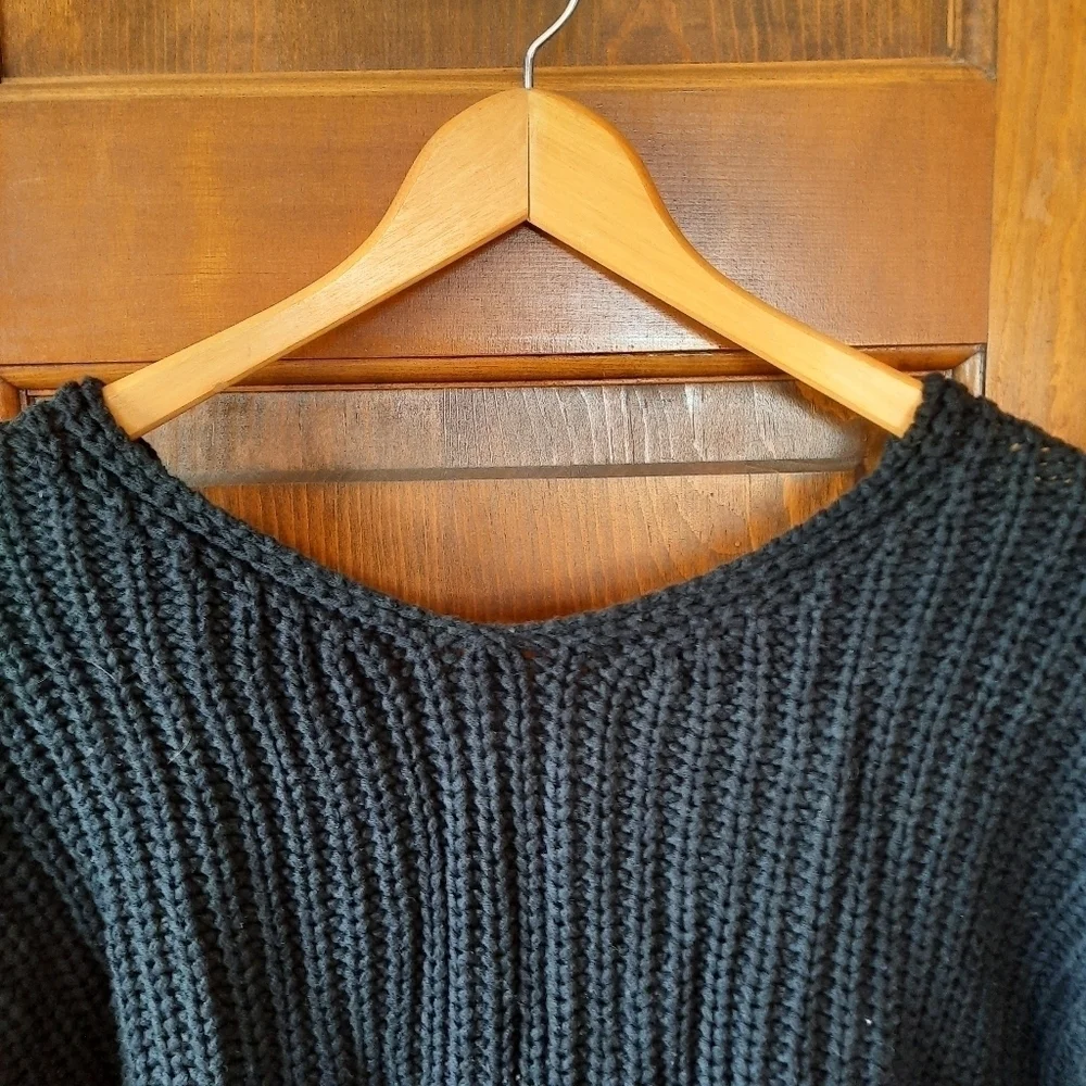 Black chunky ribbed knit crewneck sweater with back v-neck twist knot